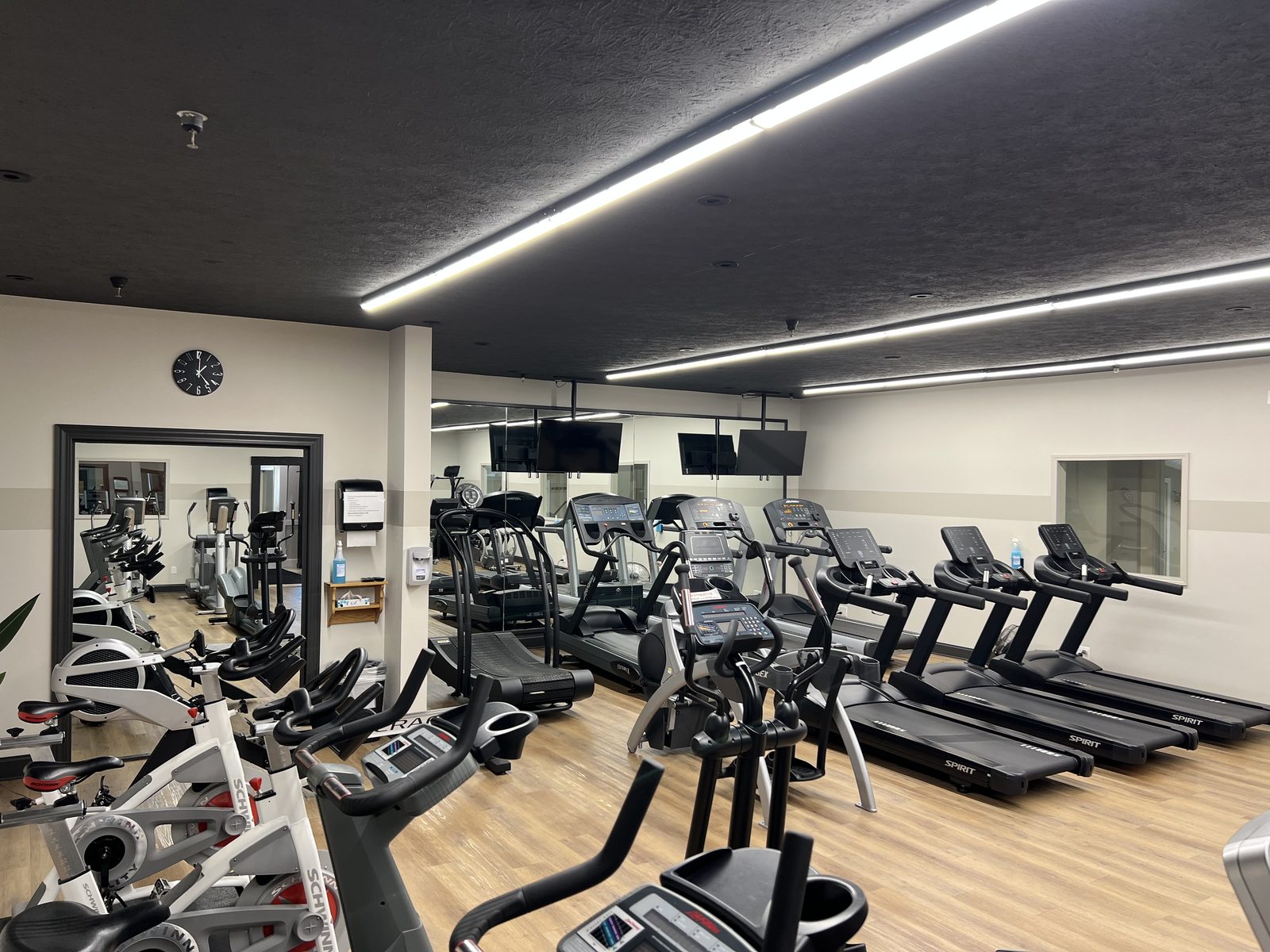 The cardio room at The Club — spin bikes, treadmills and ellipticals