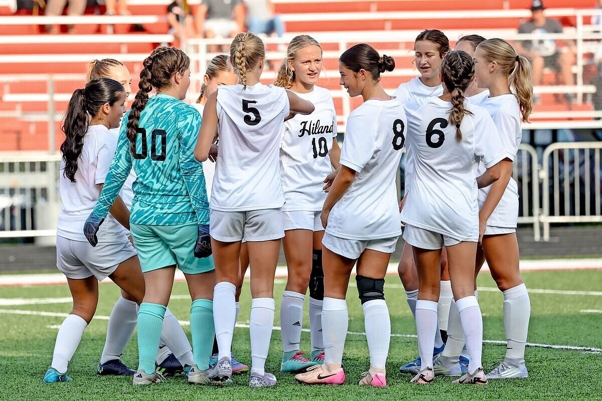 The Hiland girls soccer team gathered together on the field